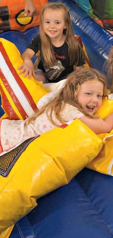 two girls playing in bounce house