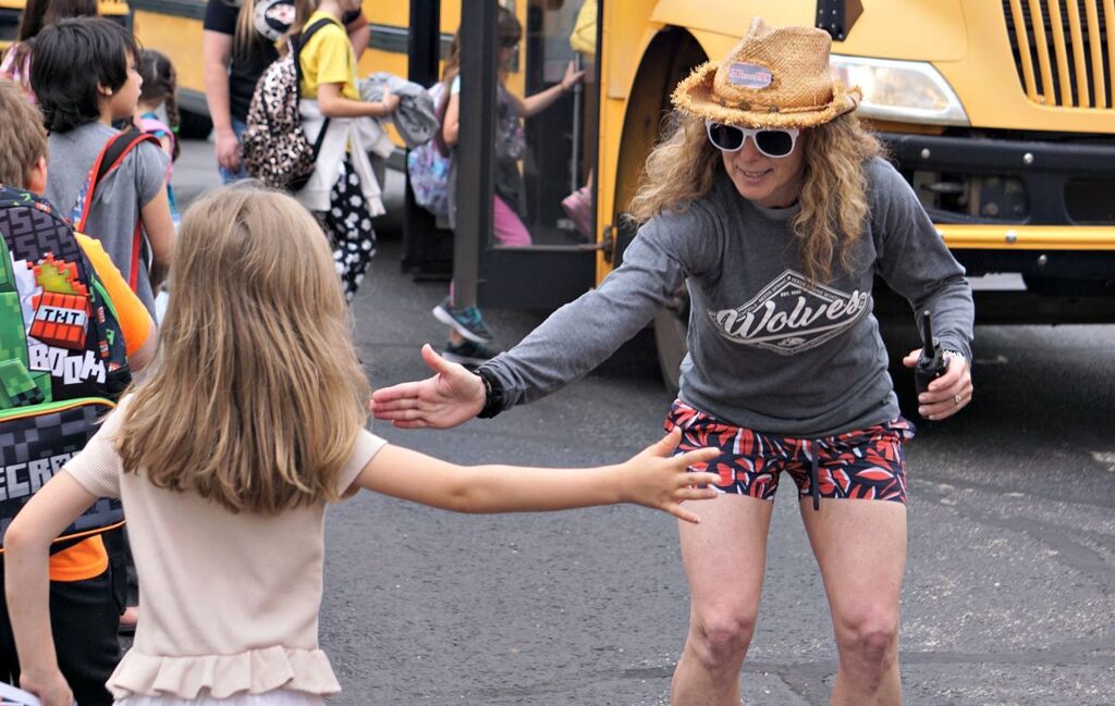 principal giving high five to student