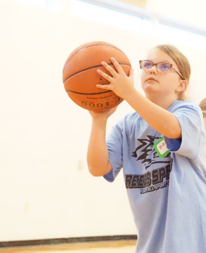 Girl shooting a basketball