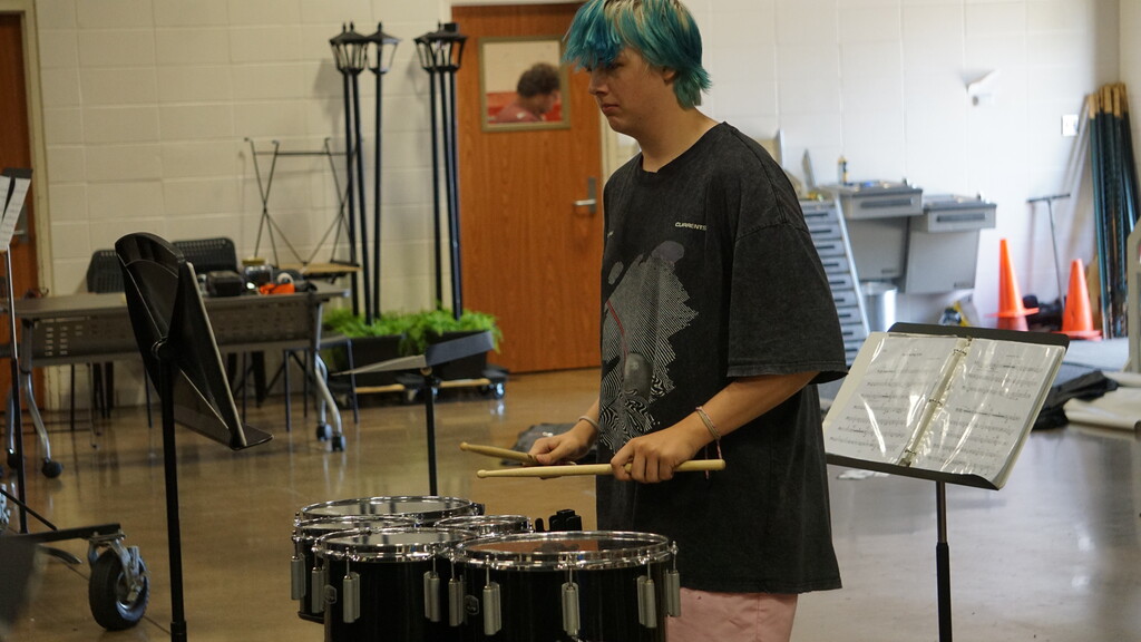 Boy playing tenor drums