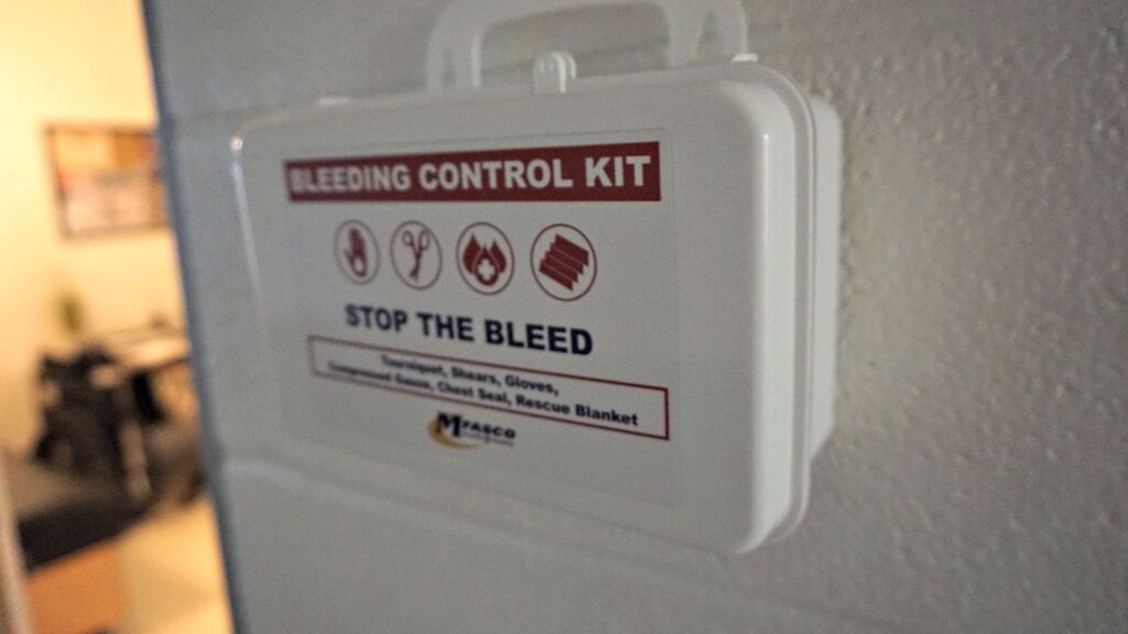 stop-the-bleed kit on the wall
