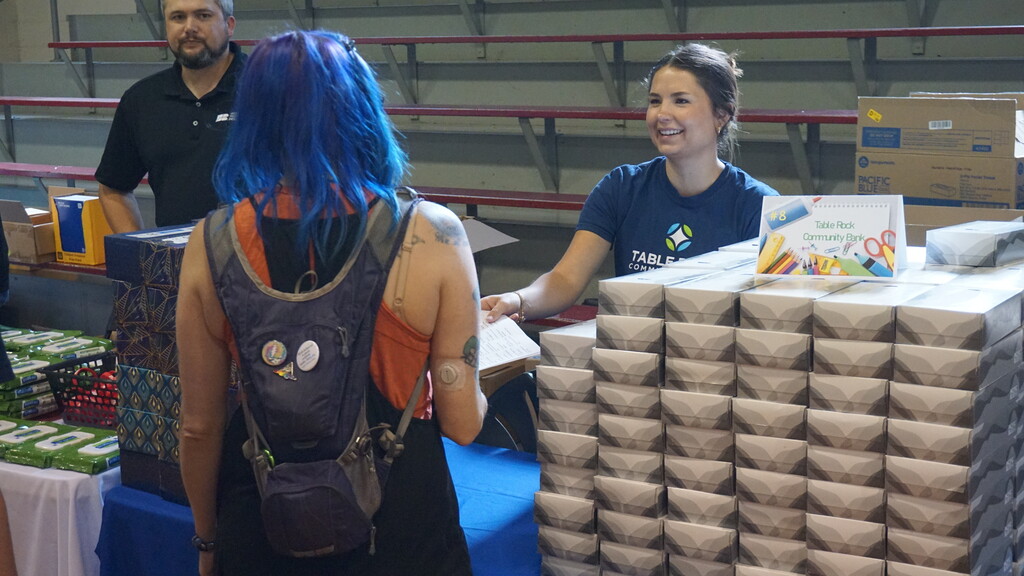 Lauren Helms handing out school supplies.