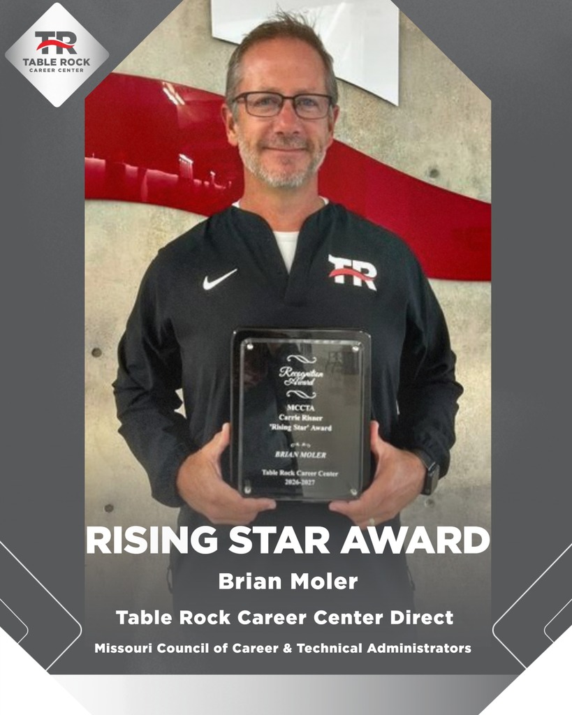 Brian Moler holding award