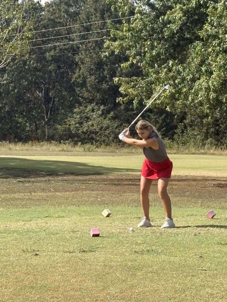 Kourtney hitting off the tee.