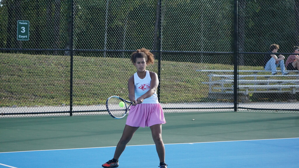 Player hits a backhand shot.