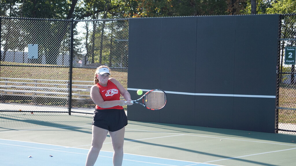 Addy hits a return shot