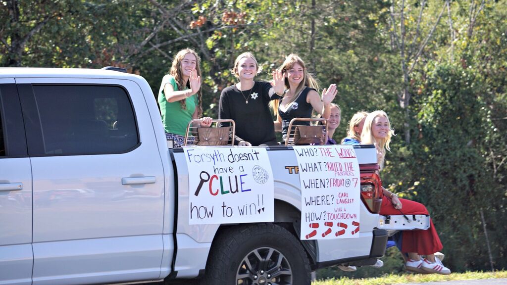 Girls golf team on a float.