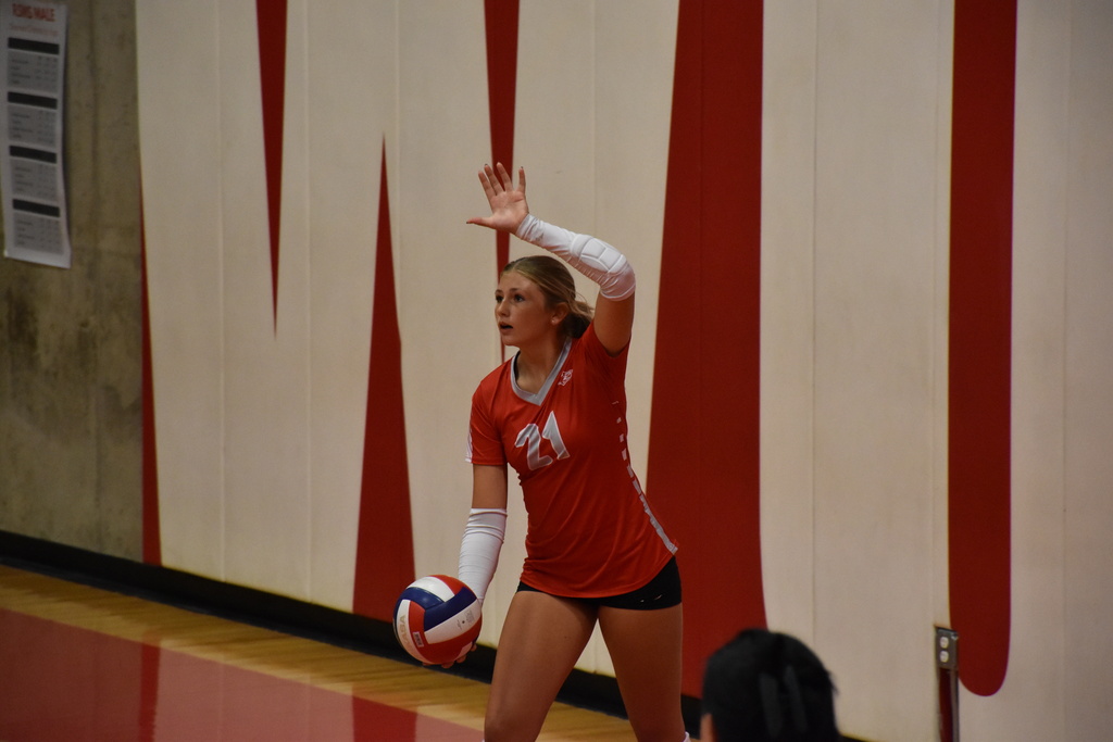 Adi prepares to serve