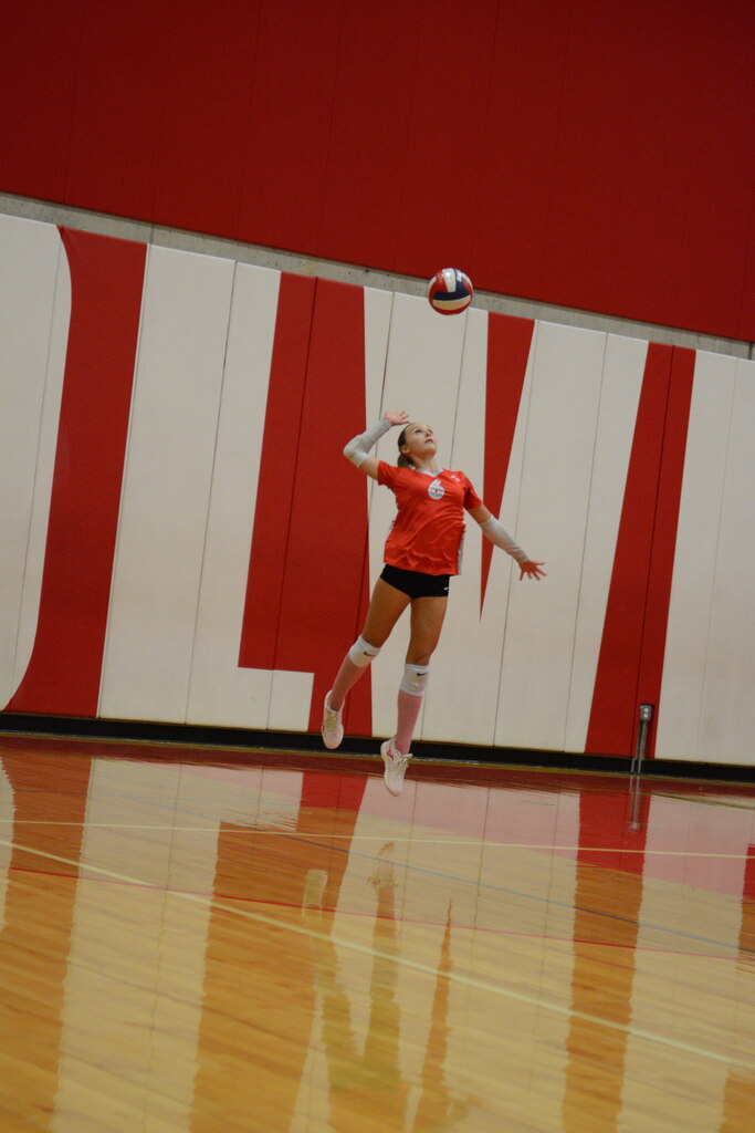 Margaret does a jump serve