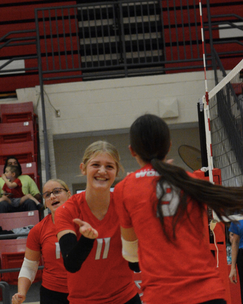 Ellie smiling at teammate