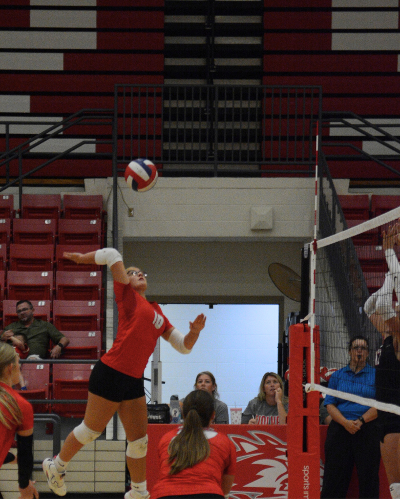 Avery spiking the volleyball
