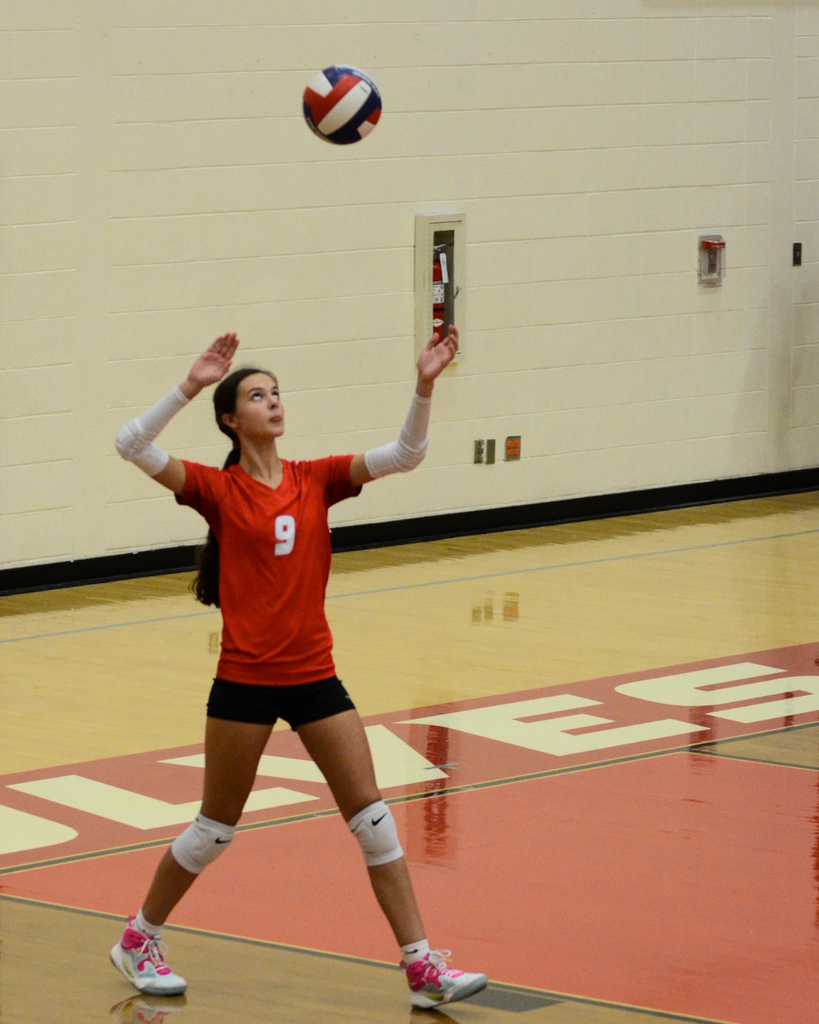 Jojo seving the volleyball