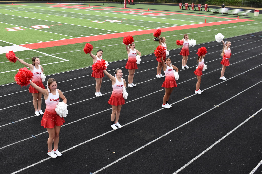 Cheerleaders perform a routine.