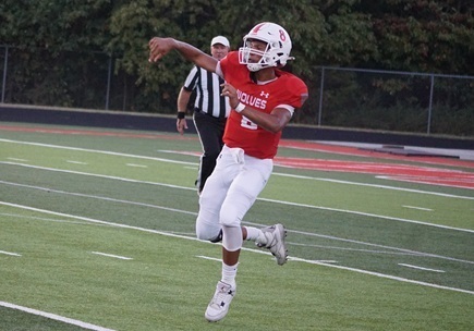 Kaden E. passing football