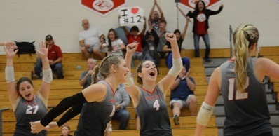 Volleyball team celebrates a win