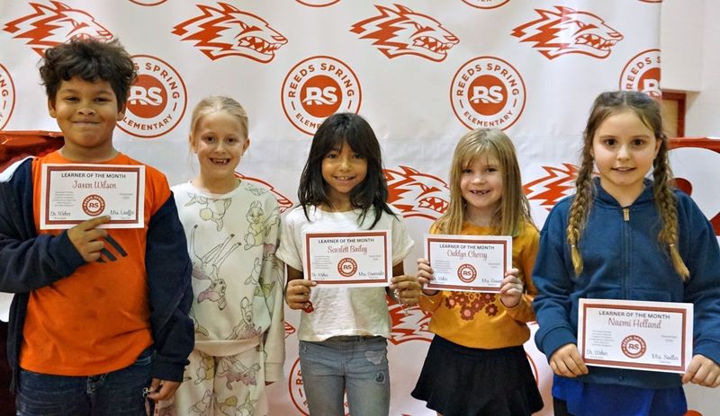 students holding cerficates