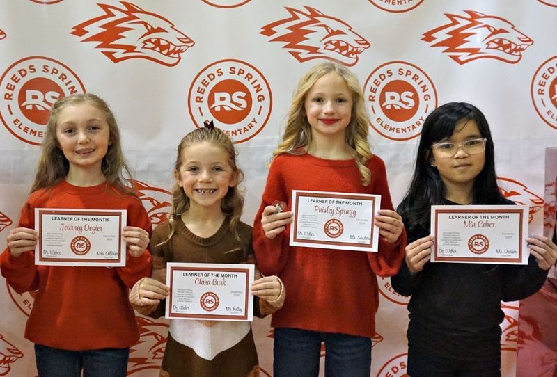 students holding cerficates