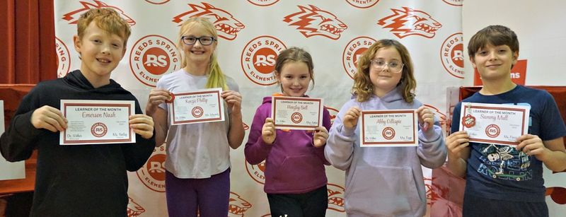 students holding cerficates