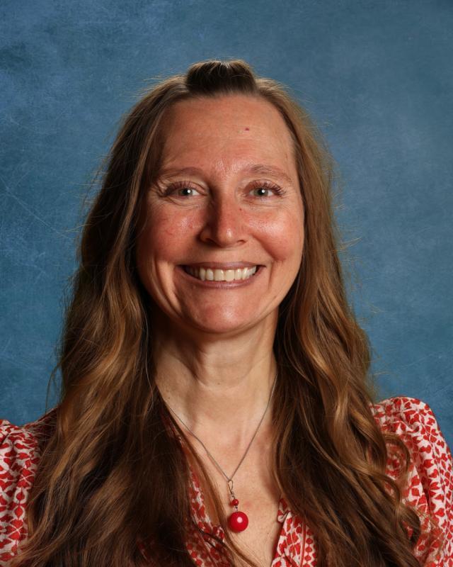 woman in red shirt smiling
