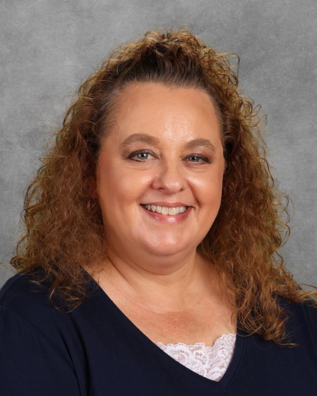 woman in dark sweater smiling