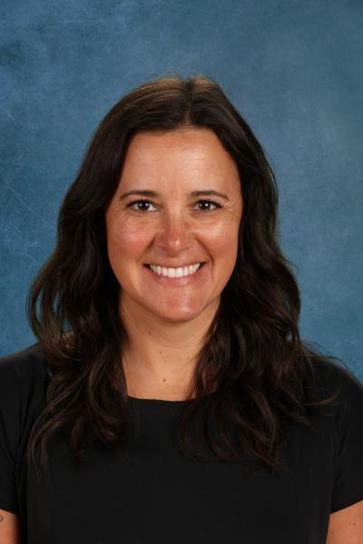 woman with long brown hair and black shirt