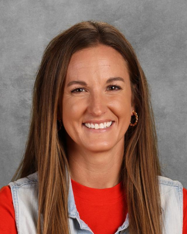 woman with brown hair and red shirt