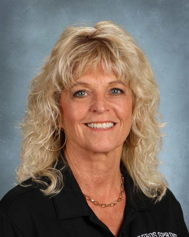 woman with blond hair and black shirt