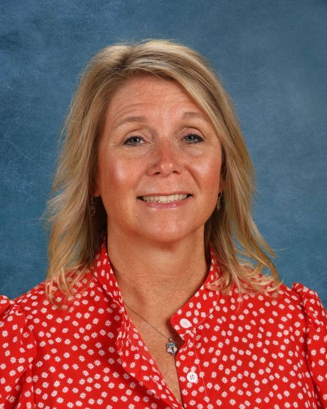 woman with blond hair and red shirt
