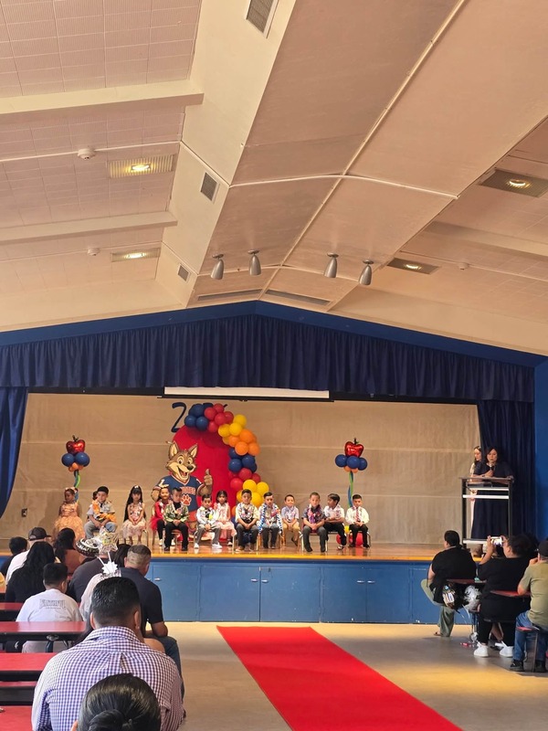 KCES promotion students on stage