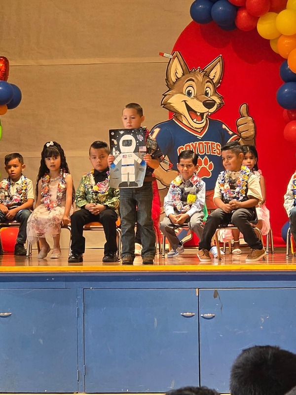 KCES kinder promotion student on stage