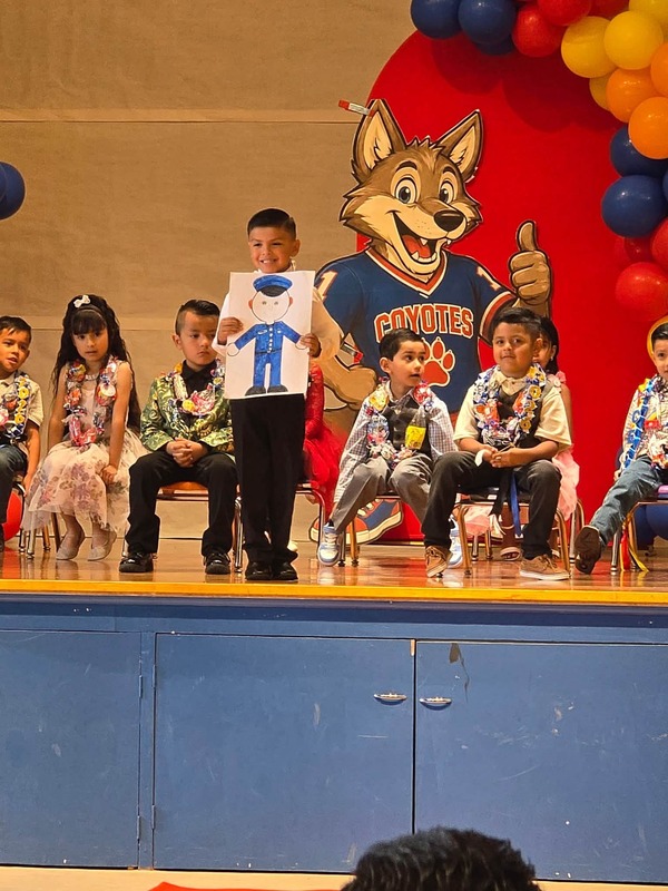KCES kinder promotion student on stage