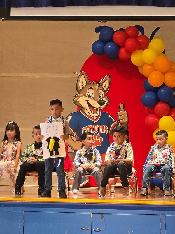 KCES kinder promotion student on stage