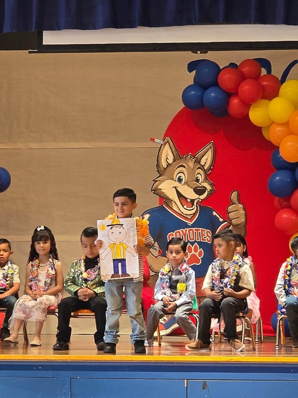KCES kinder promotion student on stage