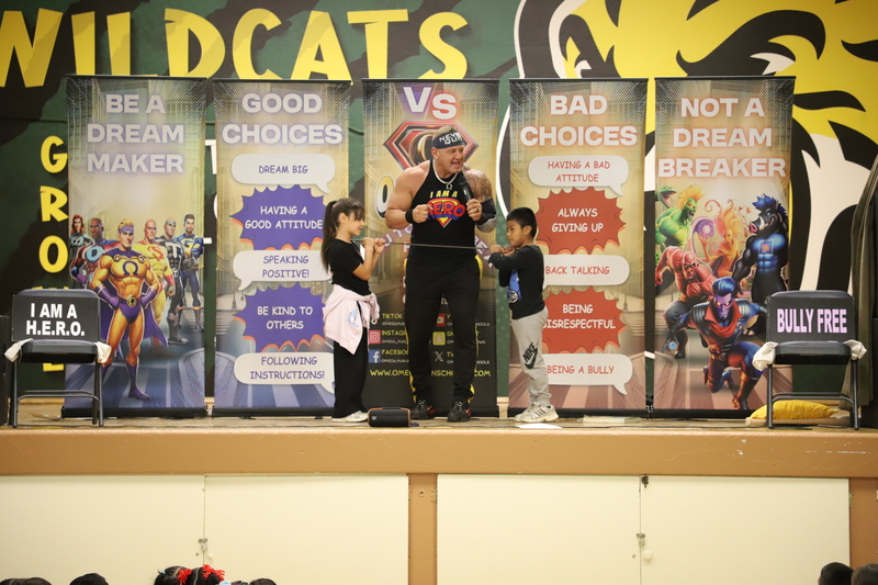 AES Assembly promoting positive choices and stop bullying students on stage