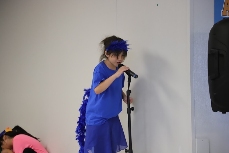 TES students on stage performing Suesstical