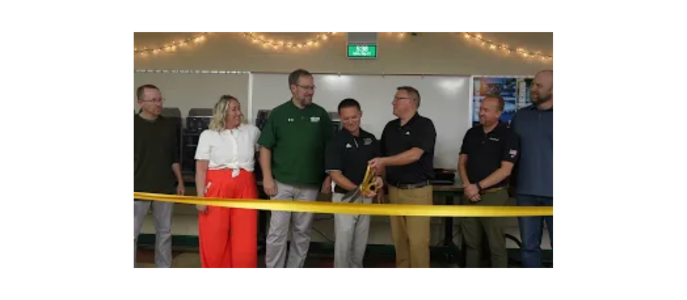 Staff cutting a ribbon