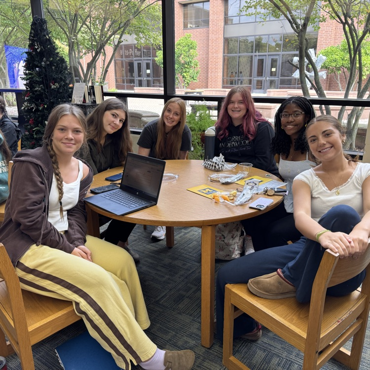 students sitting at a table  