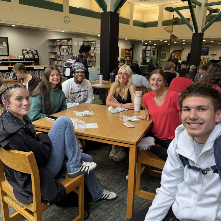 students sitting at a table. 