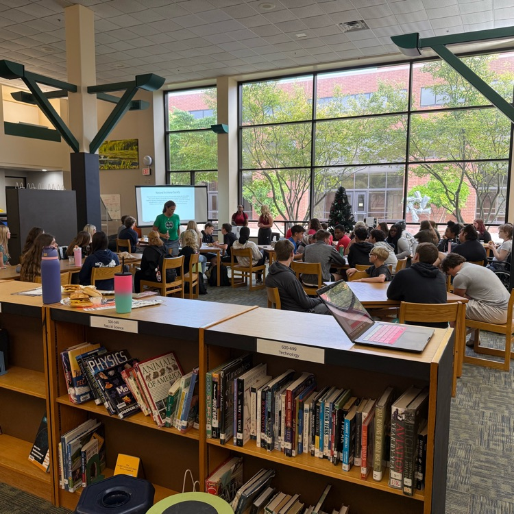 students sitting at a table. 