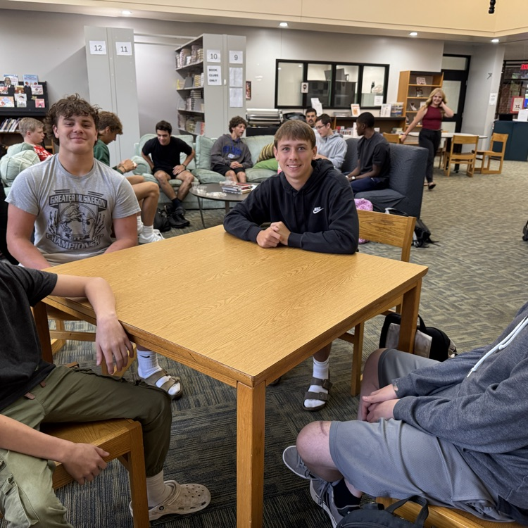 students sitting at a table. 