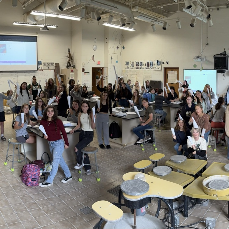 Visual arts students working together to make an installation art project.