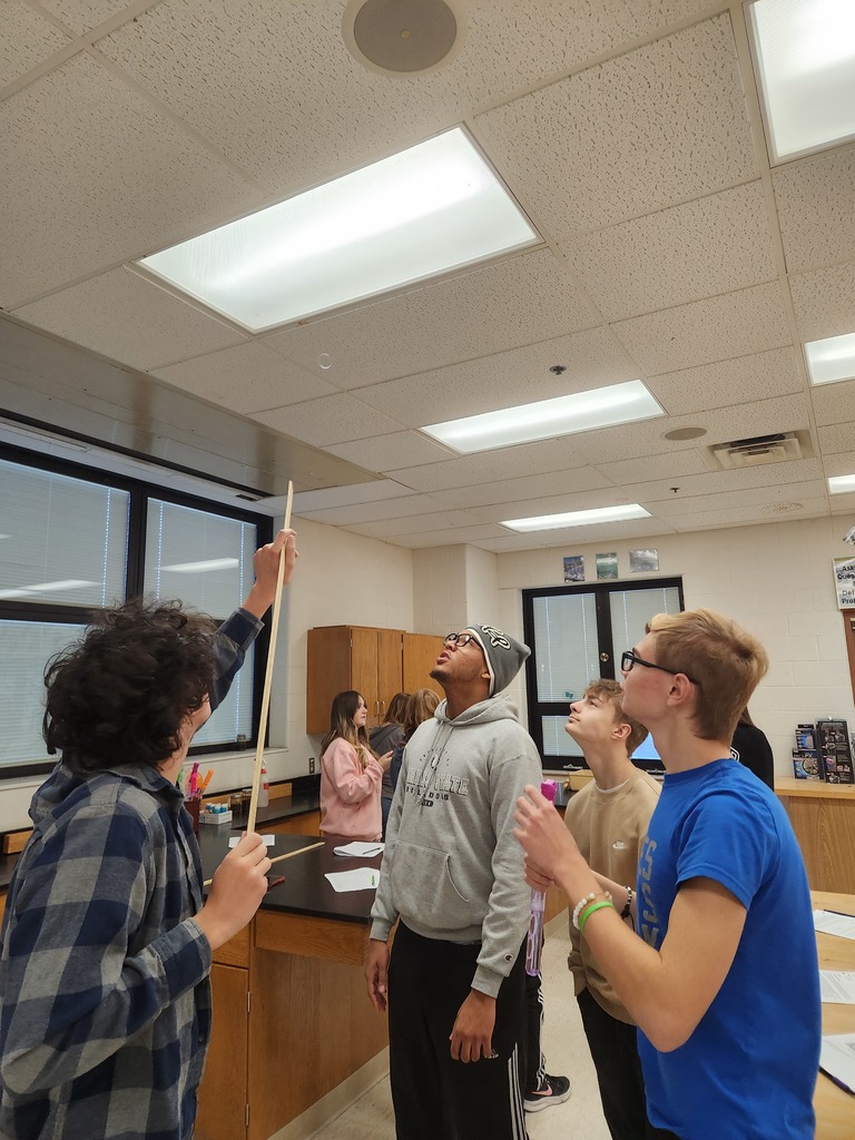 Students working in lab groups with bubbles. 