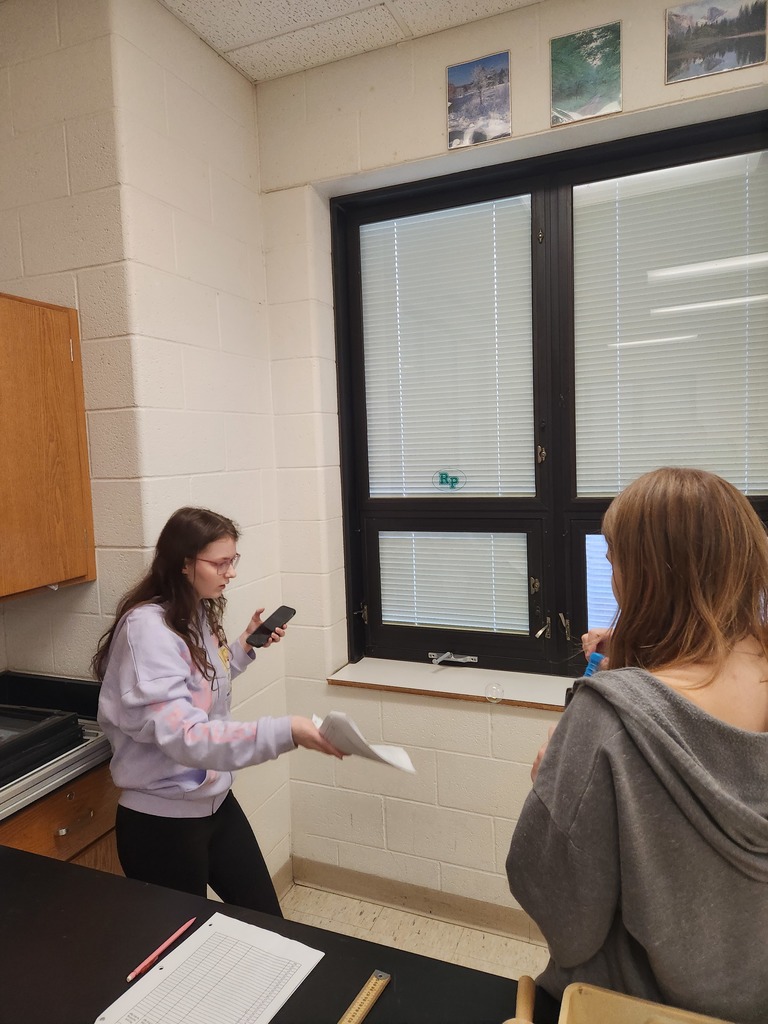 Students working in lab groups with bubbles. 