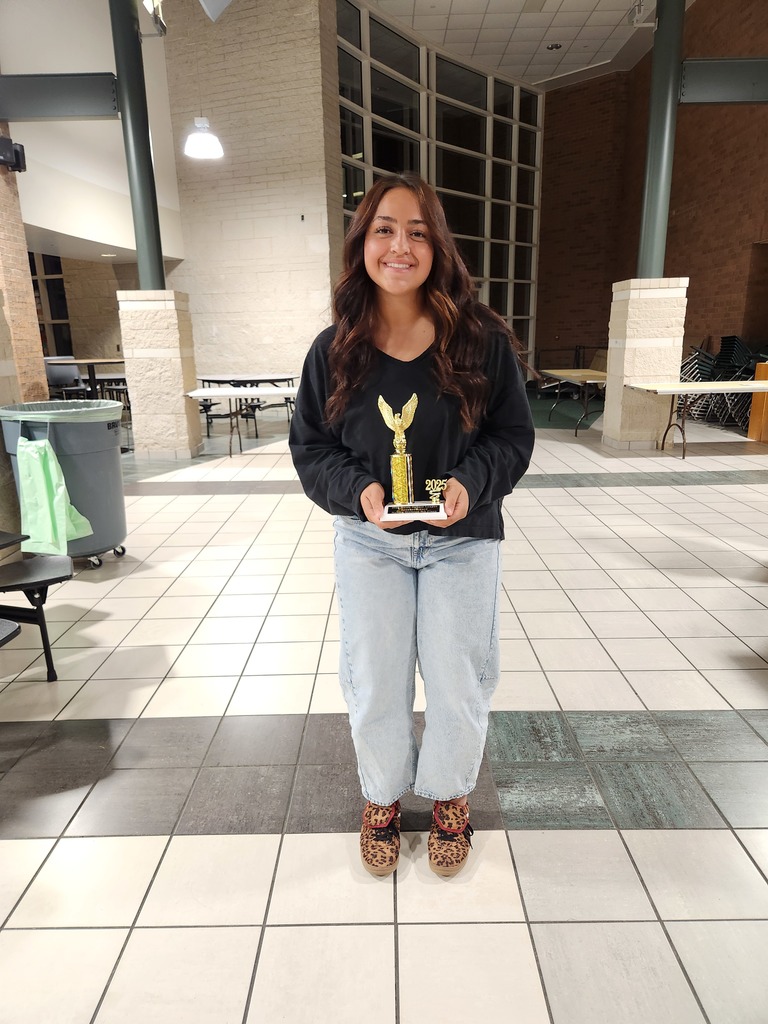 Kira Demol with her 6th place trophy.