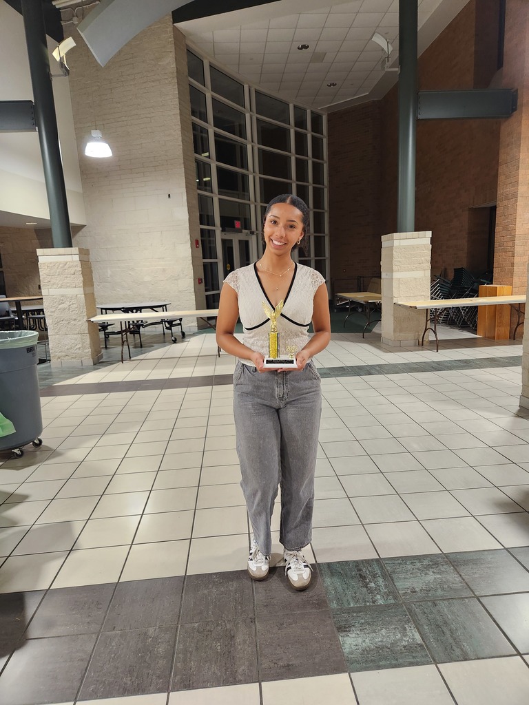 Jaylynn Acre with her 8th place trophy.