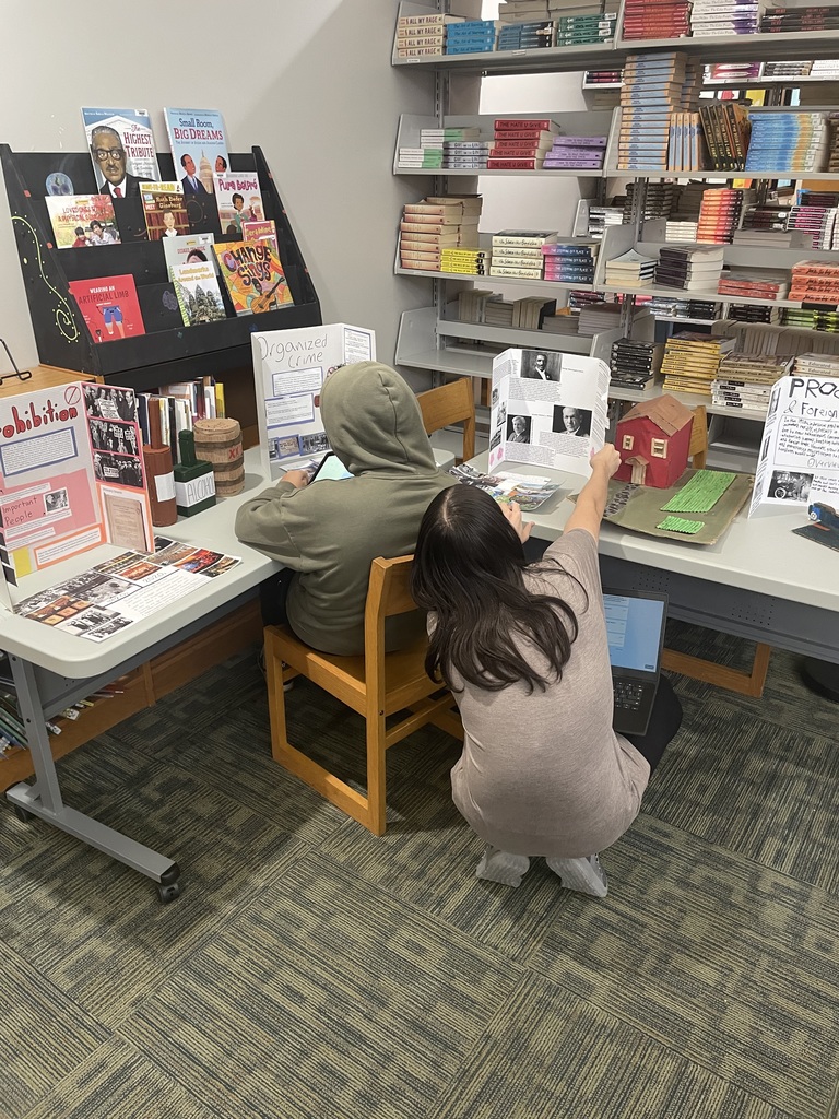 Students answering questions from other classmate's projects.