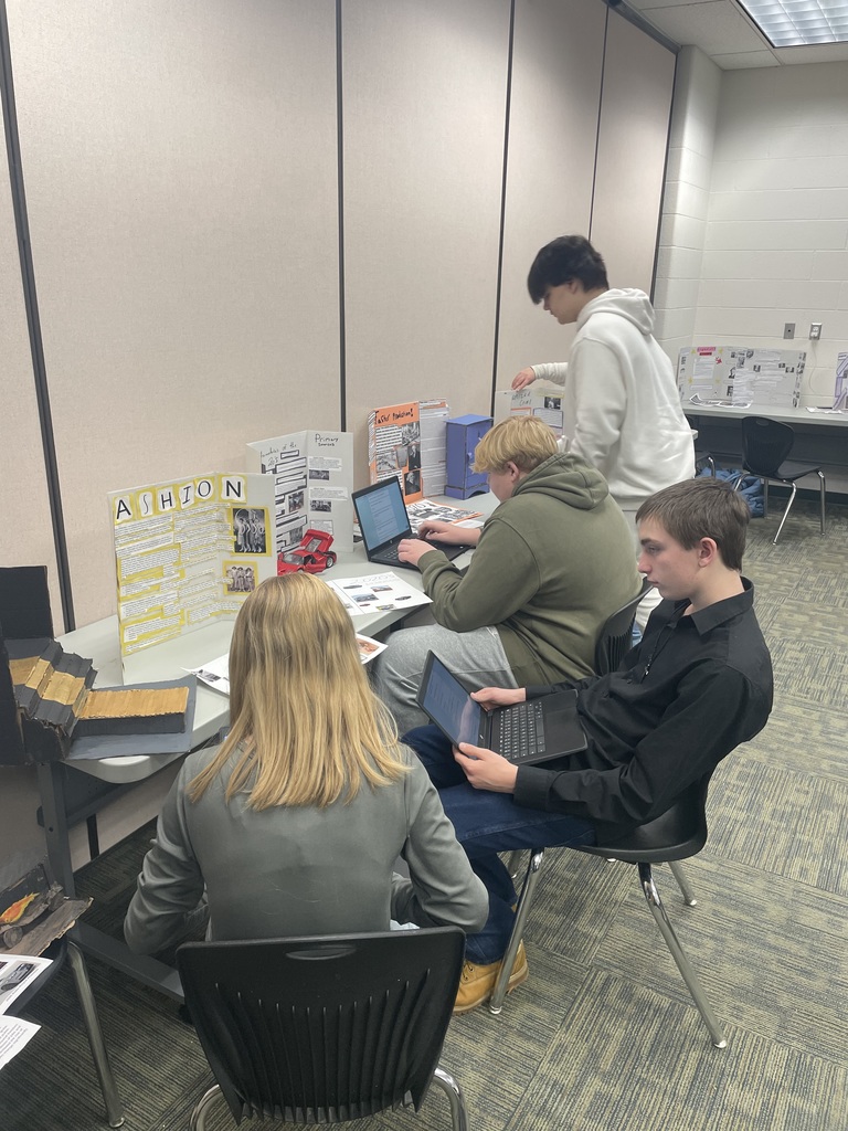 Students answering questions from other classmate's projects.