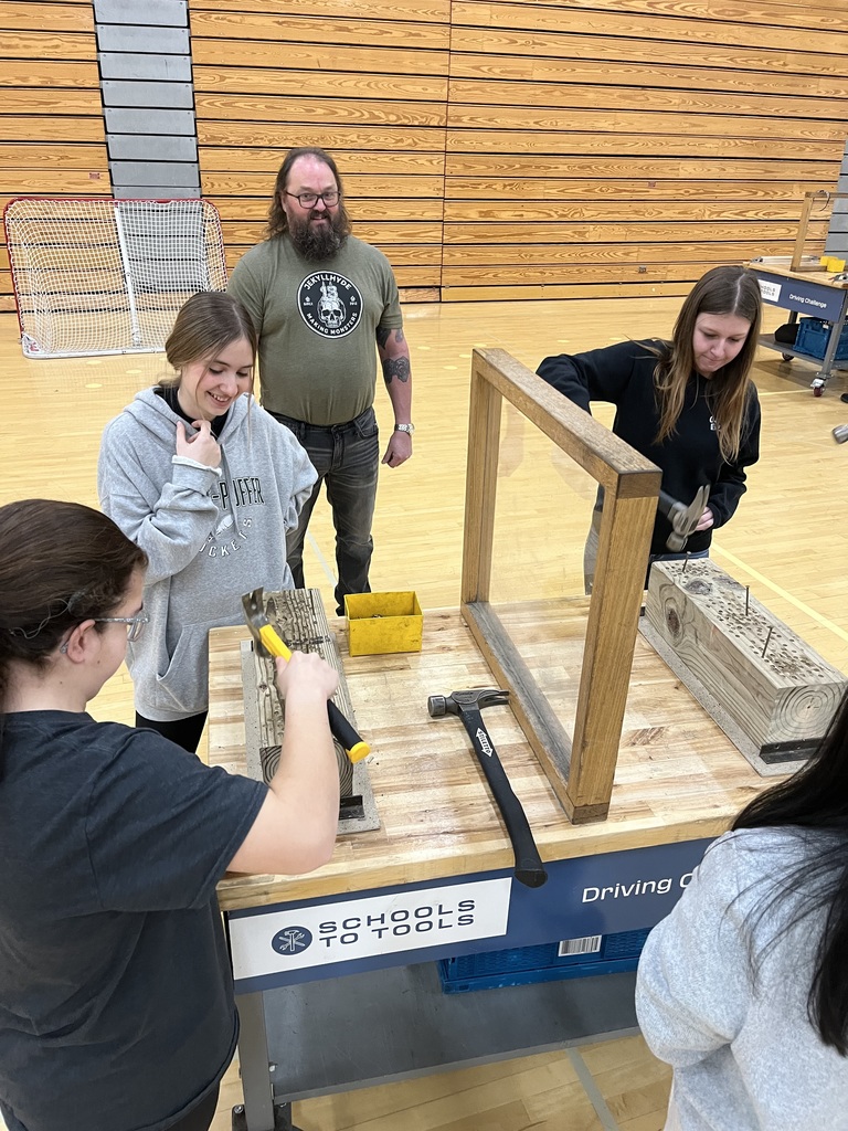 student using a hammer