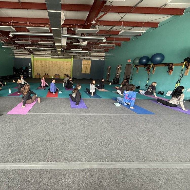 Students doing yoga at Breathe and Believe 
