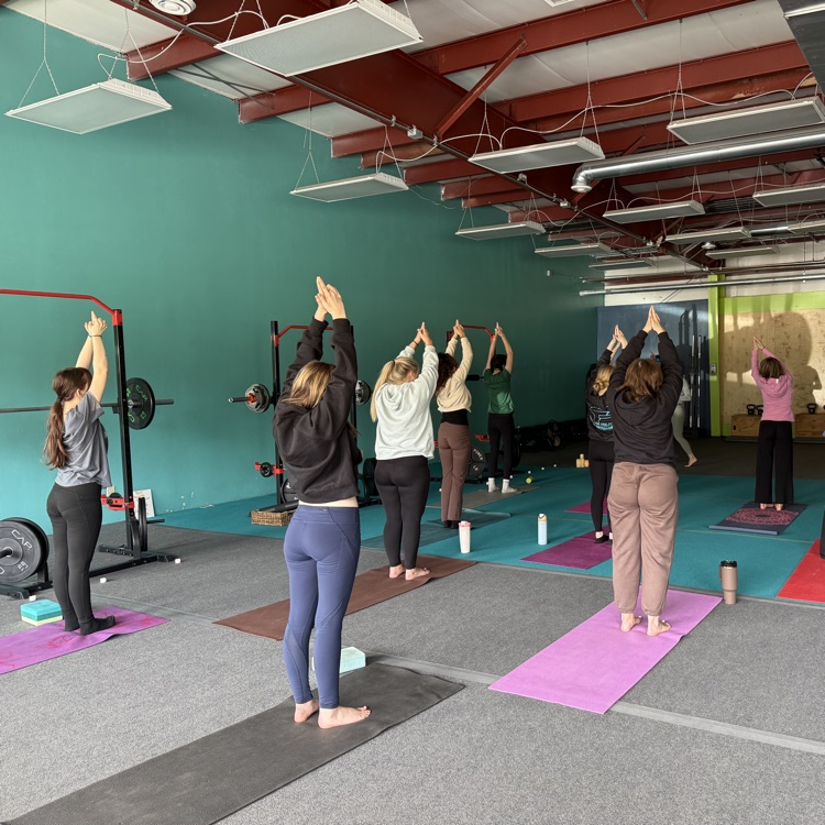 Students doing yoga at Breathe and Believe 